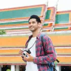 asian-man-holding-camera