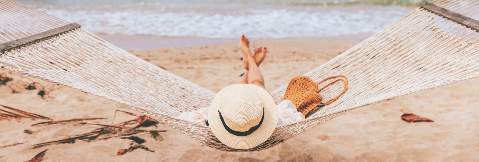 traveler-asian-woman-in-hammock-by-the-beach
